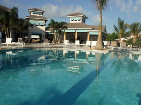 Waterfront Villa with Dock, Walk to Beach Club & Rusty Anchor Rest. 3b/r  3.5b/a