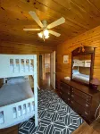 Cozy cabin style cottage tucked into the woods with a view of the water. Hotels near Howards Cove Lighthouse