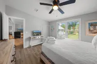 Cozy Canal Escape! Screen Covered Pool, Sunroom, Sun Deck, & Floating Boat Dock - 4-Star
