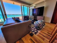 The BEACH PAD- A Beachfront,  Full Ocean View Apartment