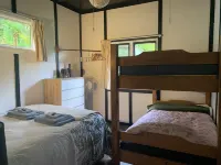 Classic Piha Bach - Seaview Road Hotels in Piha