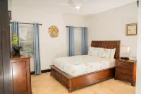 Tranquil 2 Bedroom Rental - 5 Mins to Beach, Private Deck, Pool & Hot Tub Access