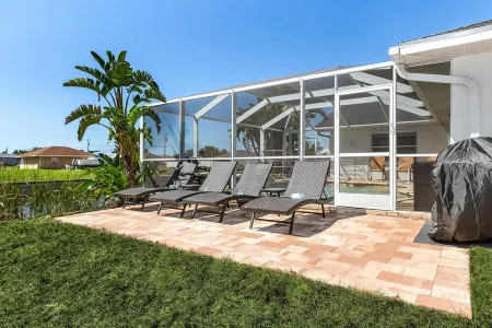 PARADISE COVE- Spacious Canal Home with htd saltwater Pool! Sleeps 13!