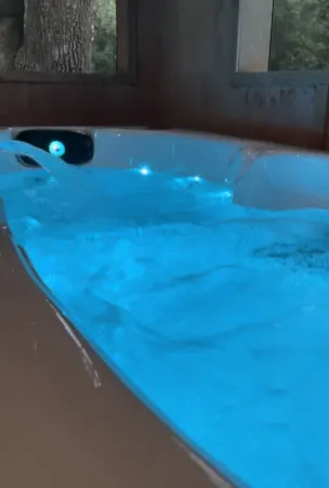 Secluded, peaceful Coastal Log Cabin with hot tub.