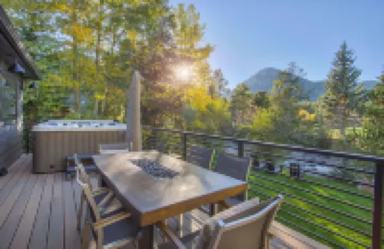 Dreamy home on river, mountain views, steps from town.