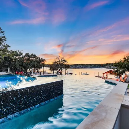 Lake Front Home with Pool, Dock, Views, Sports Court, & Beautiful Sunsets!