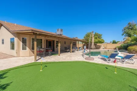 HUGE, heated pool. Family friendly, toys for all!  Big & beautiful backyard!