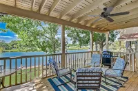 Dog-friendly water view home with inviting porch, AC, W/D, & modern charm