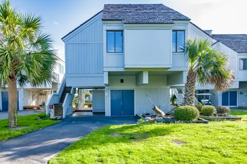 Walk to the beach or pool in this cozy villa. 2 deck spaces with 2 golf carts for enjoyment