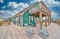 Martinis & Bikinis, a beach front house with toes in the sand drink in the hand.