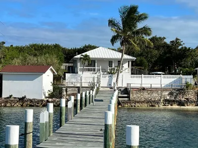 Waterfront Beach Bungalow with 150 Foot Dock on Guana Cay and Waterside Pergola Hotels near Scotland Cay