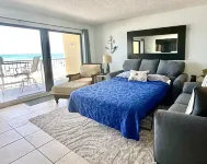 Enjoy beautiful sunsets from the balcony or wade into the waves just steps away! Hotels near Tiki Gardens - Indian Shores Beach Access