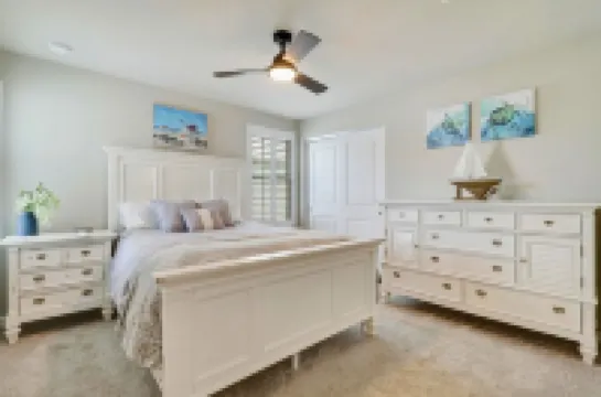 Down the road from the beach! Coastal home w/ full kitchen, 3BR, patio & grill.