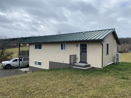 Family friendly cottage, covered deck, close to lake to fish, swim, and boat