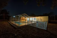 Four Beds, three baths, heated pool, and a Golf Course. What more do you need!!