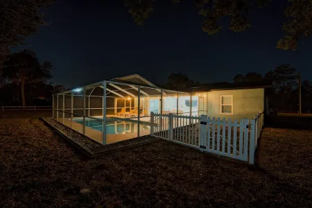 Four Beds, three baths, heated pool, and a Golf Course. What more do you need!!