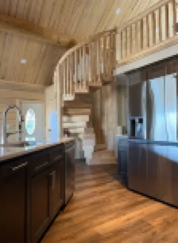 Beautiful hand-crafted log cabin on Horse Creek one block off Main Street.