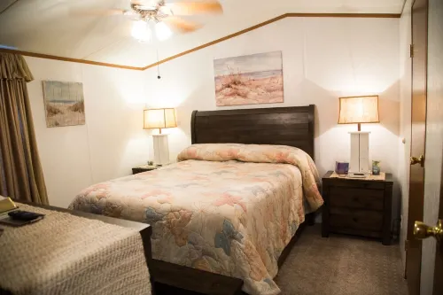 Lake front retreat, covered boat dock, large deck , fenced play area, RV parking