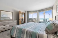 Scenic ocean front condo - panoramic views, walk out to beach!