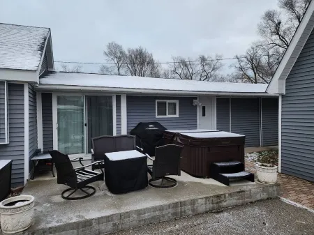 Cabin in Oscoda with hot tub and game room