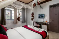 Saffron Beach Bistro & Cottages Отели в г. Энтеббе