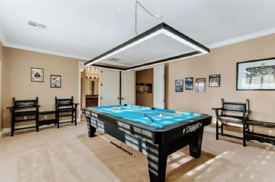 Luxury Retreat With Heated Pool & Hidden Game Room 6 Bedroom Home by RedAwning