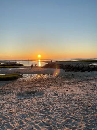 Walk to Rock Harbor Beach from your spacious Orleans coastal retreat
