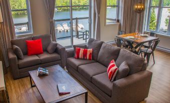 a living room with two couches , one on the left side and the other on the right side of the room at Le Viking Resort & Marina