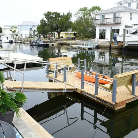 Unique waterfront home, Hot Tub, private boat dock, walk to beach, pet friendly