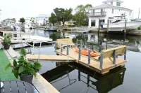 Unique waterfront home, Hot Tub, private boat dock,  walk to beach, pet friendly