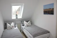 90 sqm bright, child-friendly apartment Hotels in Vollerwiek