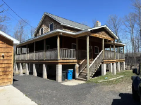 Six bedroom home with a hot tub, pool and an outdoor bar on a two acre lot.
