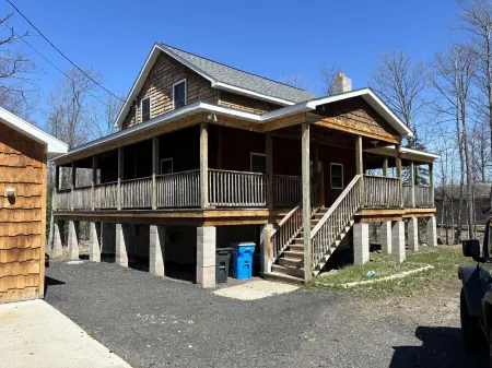 Six bedroom home with a hot tub, pool and an outdoor bar on a two acre lot.