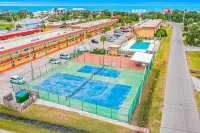 Condo across the street from the beach with pool, tennis,  washer/dryer