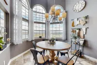 Lavish lakefront retreat in private island community with pools, tennis, & gym