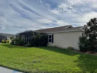 Charming Corner Lot with Golf Cart and Screened Lanai - Inviting Escape