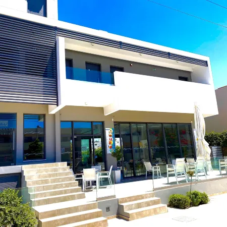 Agrelli Hotel & Suites Отели рядом с достопримечательностью «Пляж Кардамена»