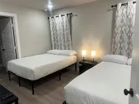 New Charming 3-bedroom home each w/TVs, 6 Beds, 2 Full Bath, Corner lot parking.