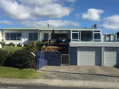 Lovely sunny home with beach views to the front and county views at the back.