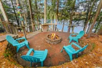 Lakefront retreat 30 min to Traverse City. Hot tub, fire pit, kayaks, game room.