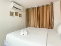Wooden Accents 1BR at Podomoro City Deli Medan Apartment By Travelio