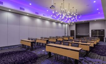 a large conference room with multiple rows of tables and chairs arranged for a meeting at Courtyard Lake Jackson
