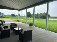 Barndominium in the country. Two acre fishing lake, large porch and Pickleball.