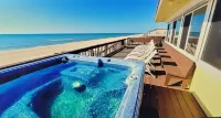 Great price!Beachfront with Stunning gulf view from this Great home with hot tub