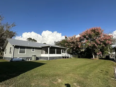 Water view Home with Dock on  Canal with access to Lake!