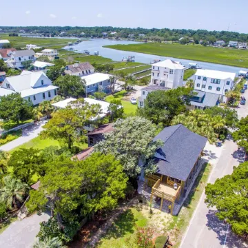 Classic Pawleys. Just Renovated. Long, breezy porches. Steps to beach and creek.