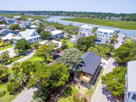 Classic Pawleys. Just Renovated. Long, breezy porches. Steps to beach and creek.