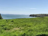 Rustic vintage cottage in Duck Cove with limited ocean view.