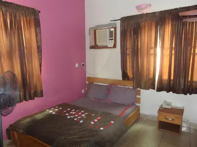 DC Bar & Suites Hotels near Oluwaga Shopping Complex