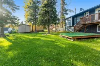Dog-friendly home with a fenced yard, putting green, & shared washer/dryer